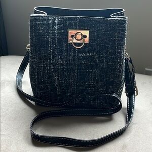 NOATD Black Crossbody Bucket Bag with Gold Hardware and Structured Design